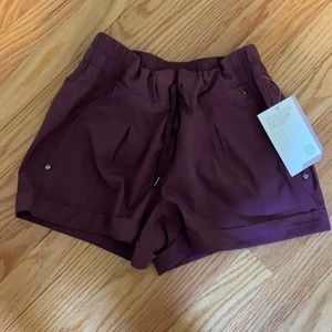 Brand new athletic shorts, plum